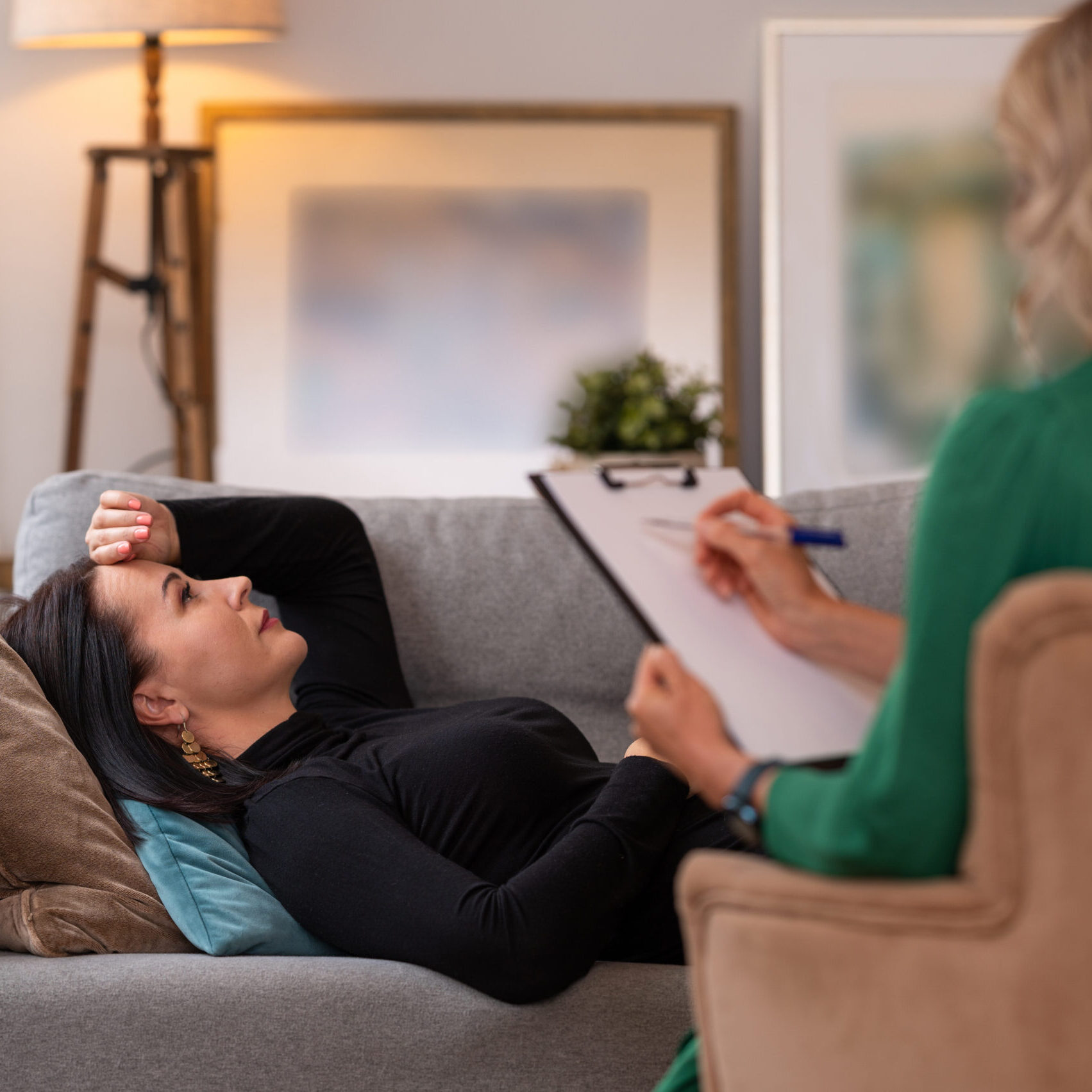 Woman lying in couch during therapy session